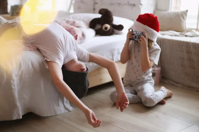 Children are photographed in a bright interior.