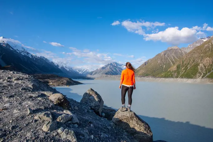 Girl Looks Out Over Mountains & Lake In Aorki Mount Cook New Zealand