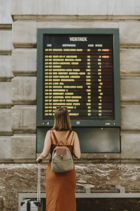 Tourist woman walking inside the train station in Antwerp