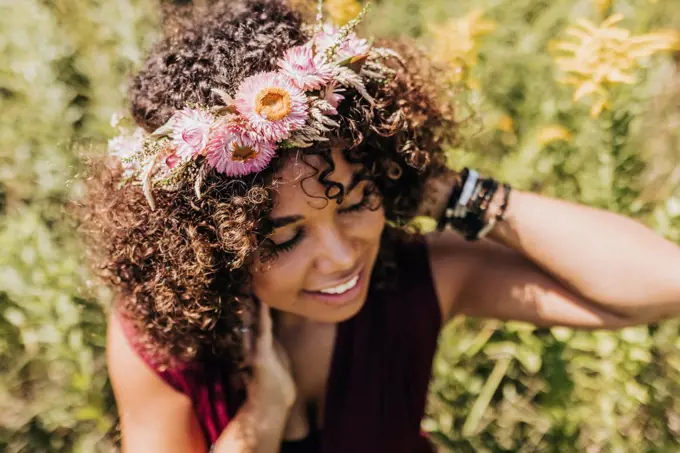 Black woman wearing pink flower crown