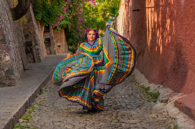 Mexican girl with folk costume for traditional mexican mariachi dance