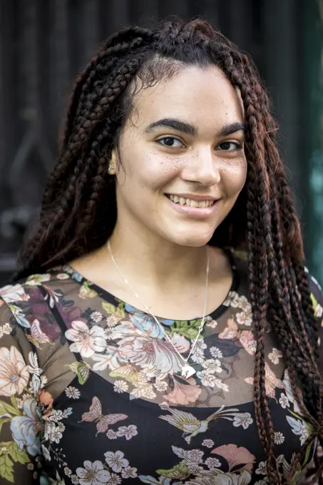 Portrait of Young Cuban Woman with freckles smiling