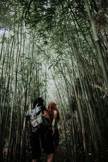 A man and woman exploring wild Hawaii