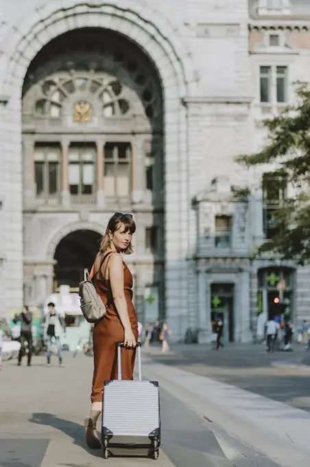 Tourist woman walking outside Antwerp train station