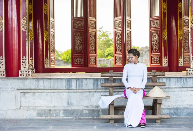 beautiful woman exploring the imperial palace in Hue / Vietnam