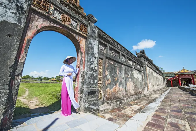 beautiful woman exploring the imperial palace in Hue / Vietnam