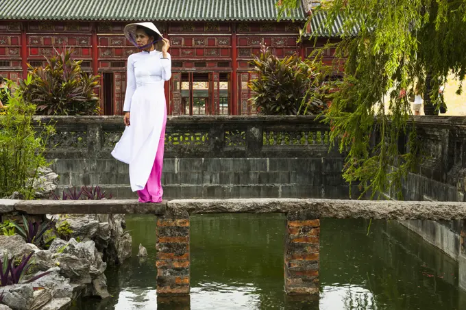 beautiful woman exploring the imperial palace in Hue / Vietnam