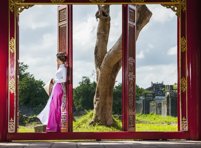 beautiful woman exploring the imperial palace in Hue / Vietnam