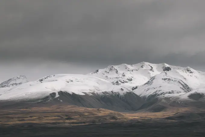 Rugged alpine mountains with snow capped peak South Island New Zealand