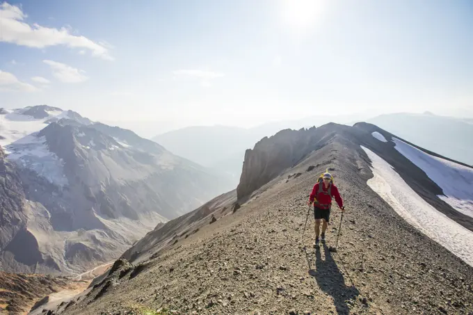 Hiker crosser talus slope in B.C. Canada.