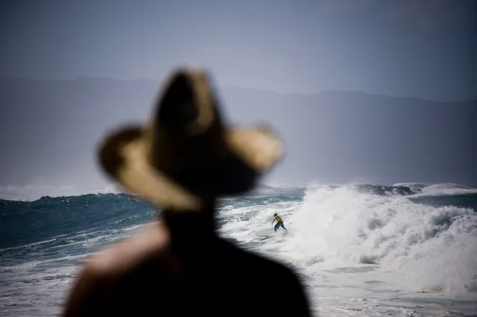 Surf scene at the 25th Eddie Aikau Big Wave Invitational. Biggest swell on the North Shore for 10 years brought in 30-50 foot waves at Waimea Bay on the North Shore of Hawaii. Have