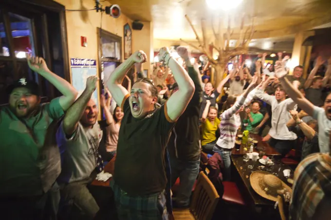 Crowds of spectators watch the World Cup match between England and the USA at a pub in Boulder, Colorado.