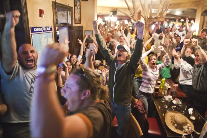 Crowds of spectators watch the World Cup match between England and the USA at a pub in Boulder, Colorado.