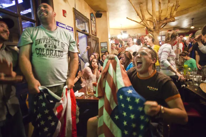 Crowds of spectators watch the World Cup match between England and the USA at a pub in Boulder, Colorado.