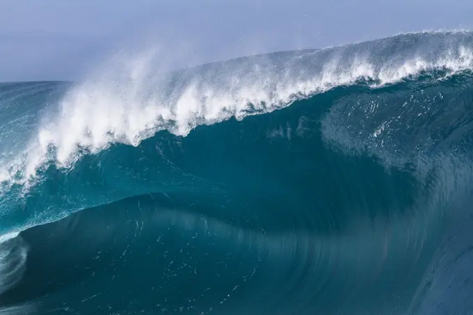 Close up of a huge and powerful wave breaking in Tahiti