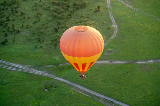 Hot air balloon viewed from above, over the Maasai Mara in Kenya