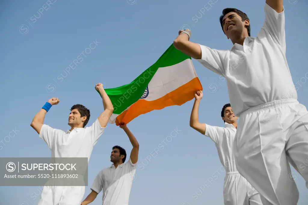 Players holding the national flag