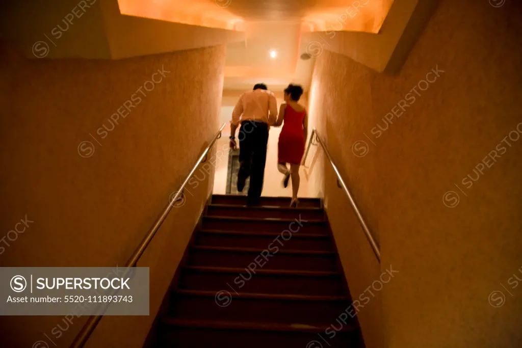 Couple climbing up the stairs