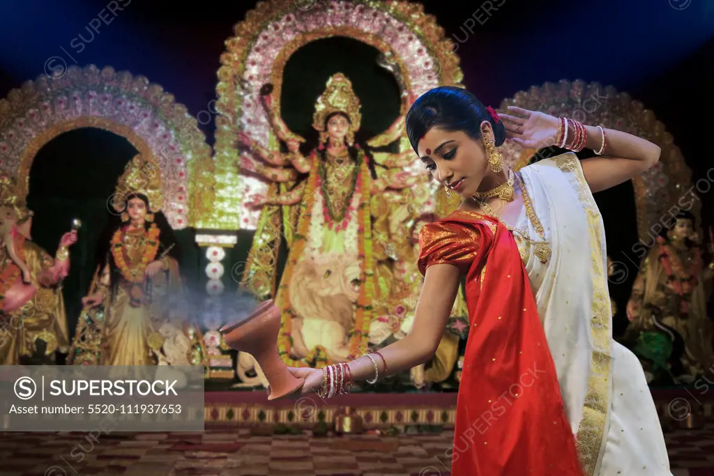 Bengali woman doing a Dhunuchi dance , Durga Puja