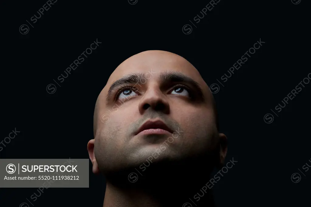 Bald man looking up