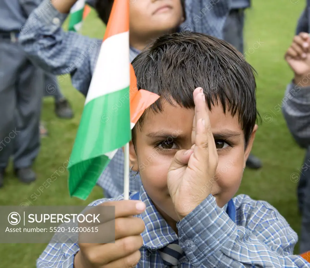 Portrait of a school girl holding the Indian flag