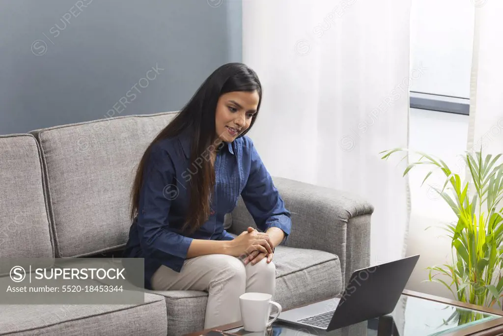 Woman attending conference on video call