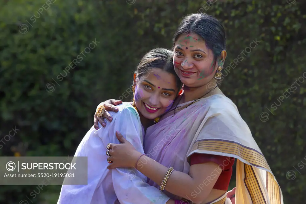Mother-in-law hugging her daughter-in-law on the occasion of Holi