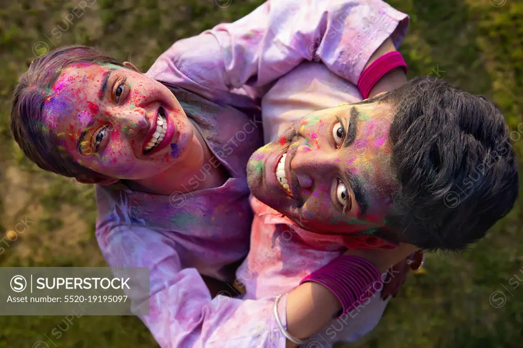 Overhead view of a romantic young couple enjoying Holi