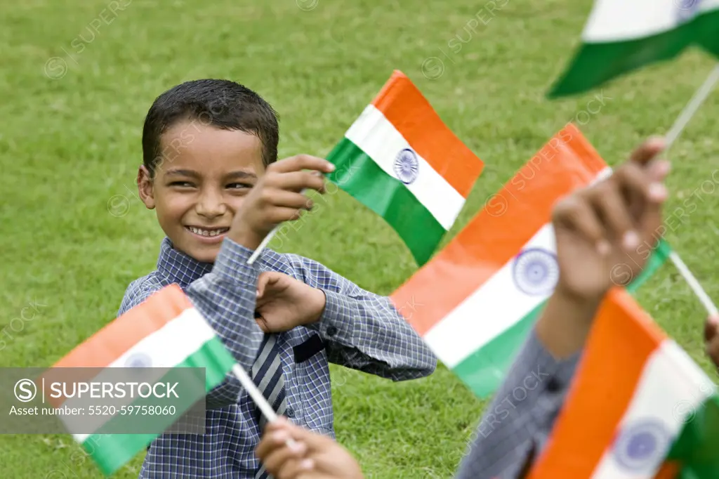 School boy holding the Indian Flag