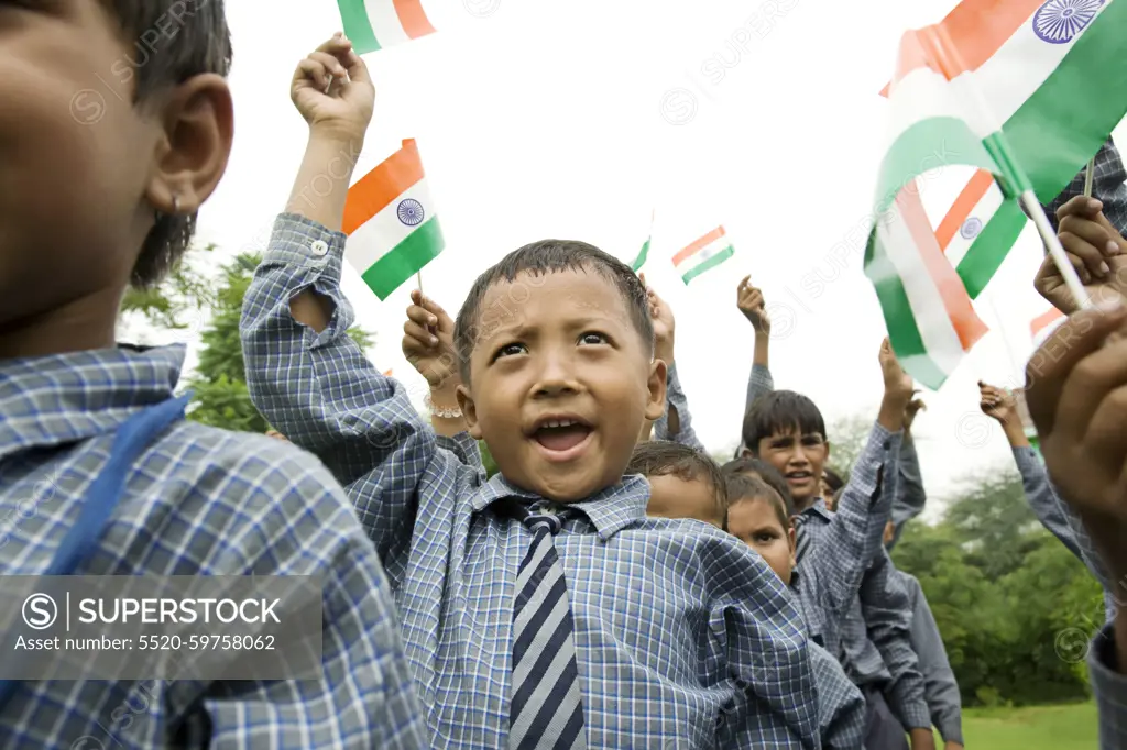 School boys holding the Indian flag