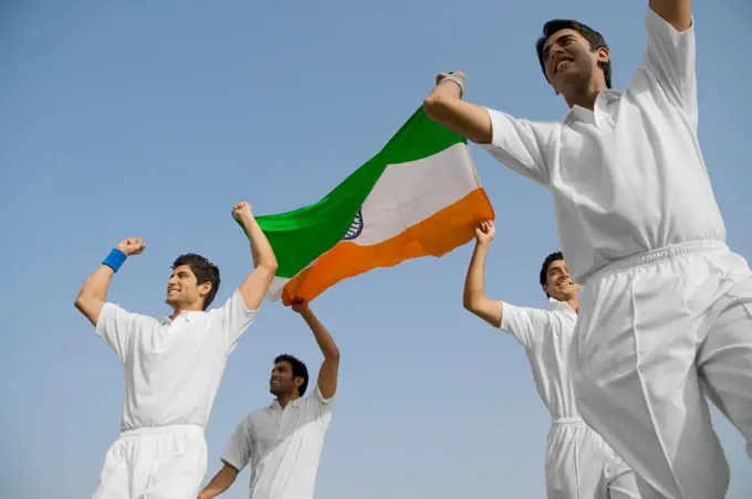 Players holding the national flag