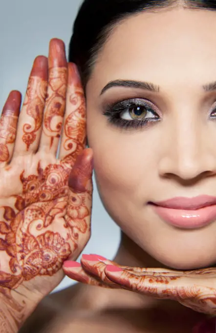 Portrait of a beautiful woman with mehndi