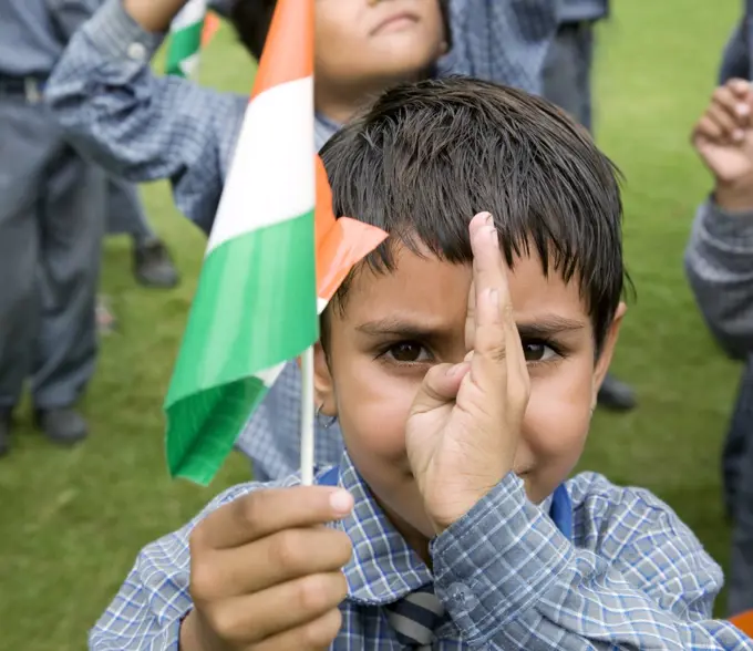 Portrait of a school girl holding the Indian flag