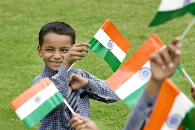 School boy holding the Indian Flag