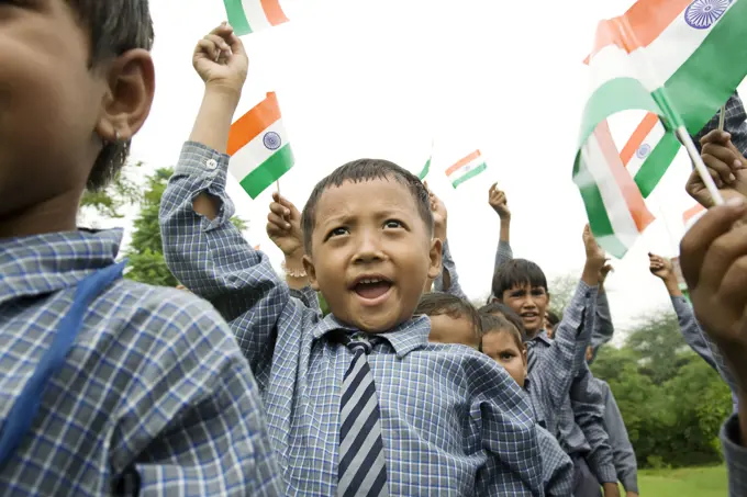 School boys holding the Indian flag