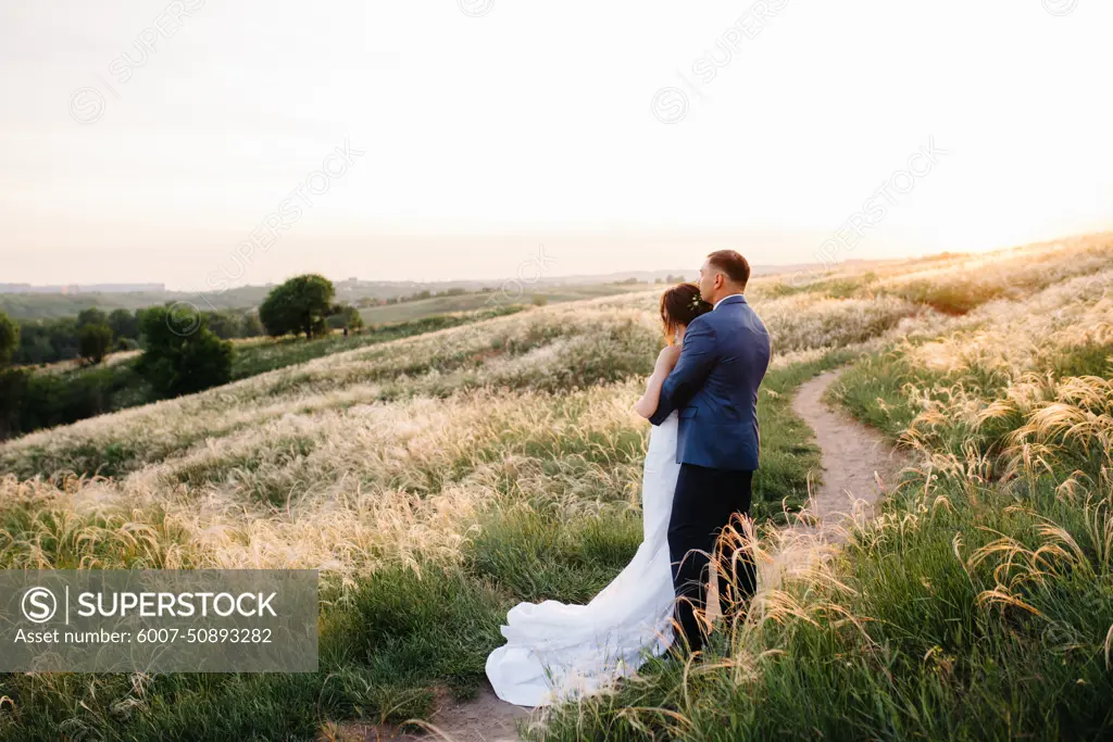 A couple in love a guy and a girl on a walk in the forest belt