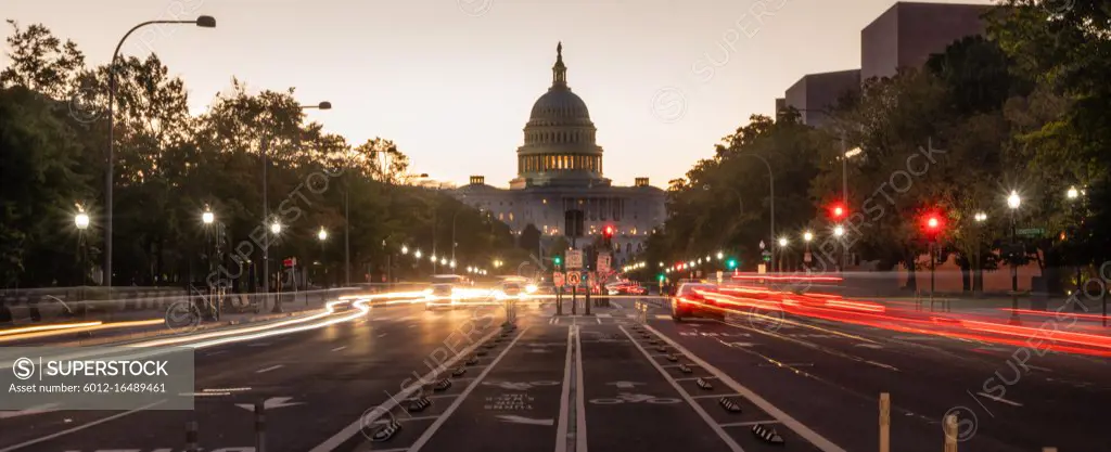 Commuters are already moving about before dawn on the streets of Washington DC United States Capital City