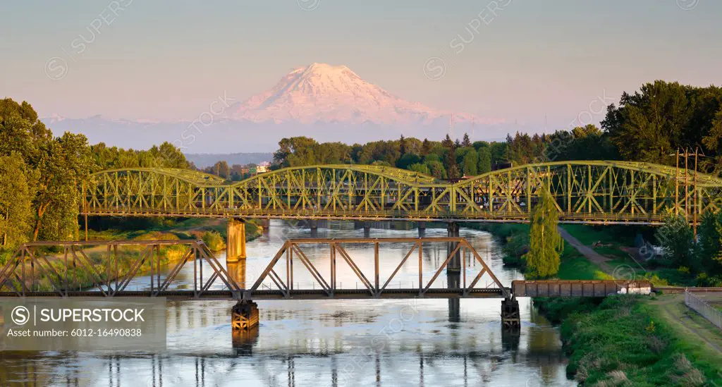 The Puyallup River meanders down from the glaciers on Mount Rainier under bridges through cities on it's way to Puget Sound