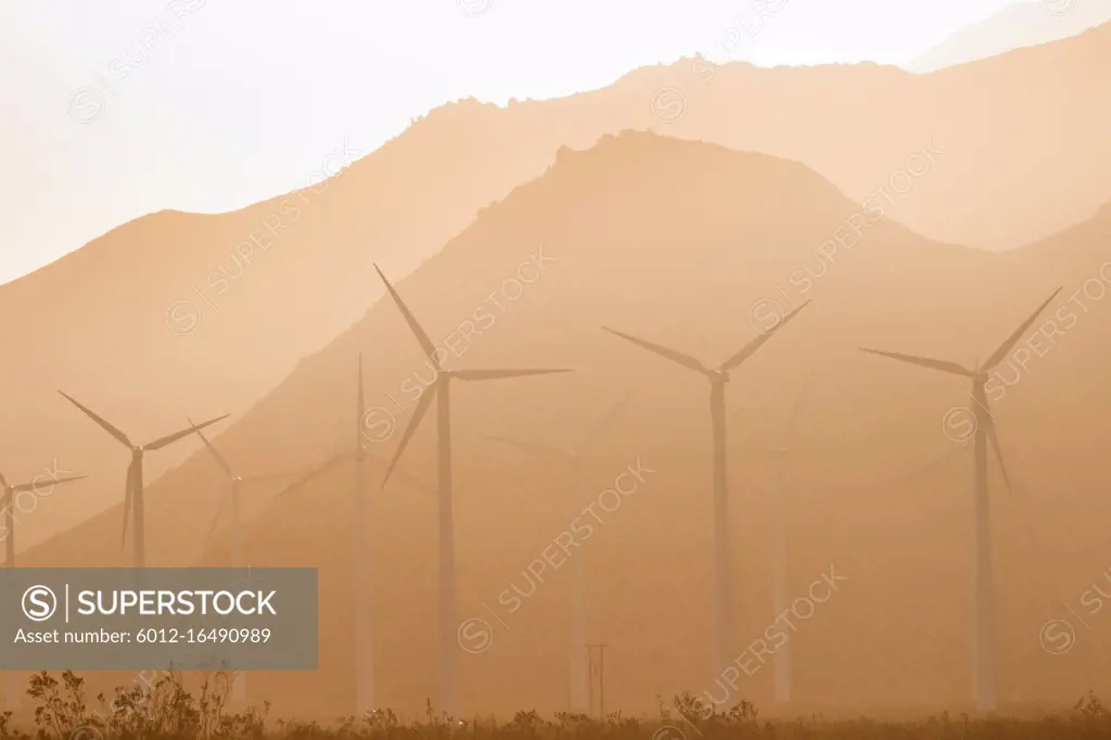 Wind turbines generate energy that goes across the mountains to LA