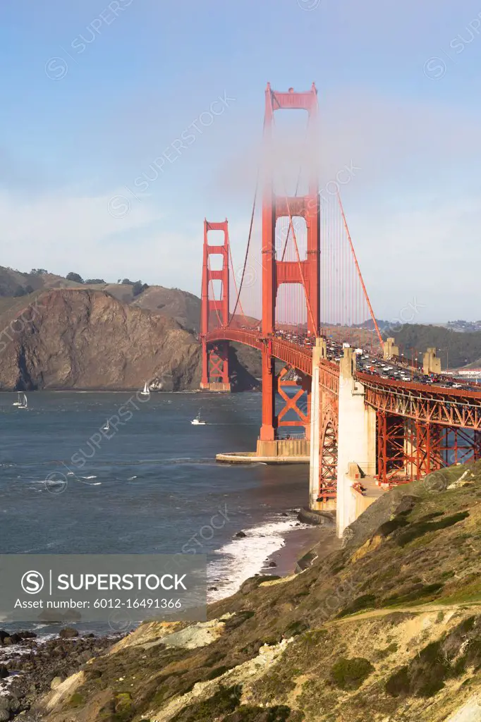 Travelers go on, under, and over the Golden Gate Bridge in San Francisco