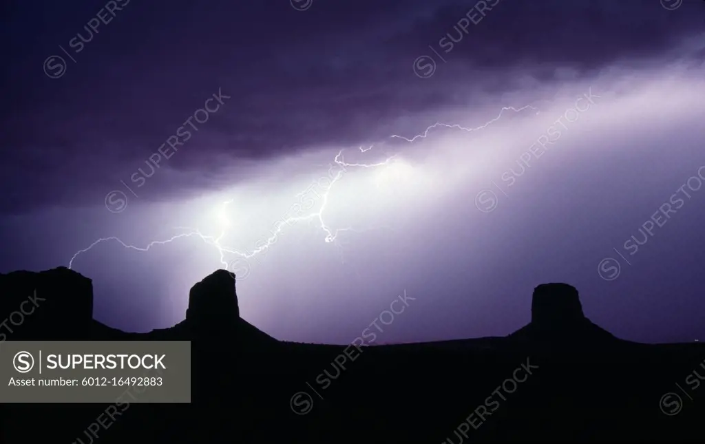 Dramatic electrical storm creates lightning bolts that hit two buttes at once