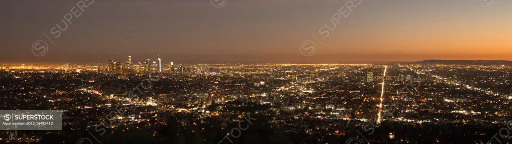 The sun a=has already set in this aerial view of the city skyline Los Angeles 