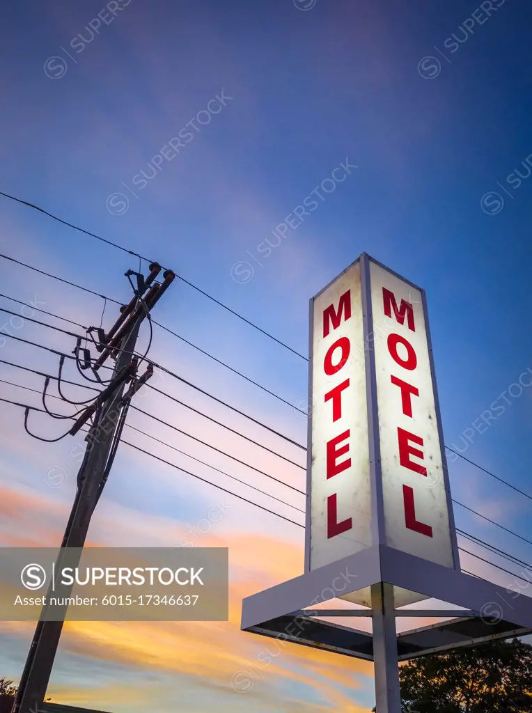 Vintage motel light sign at sunset, New Zealand