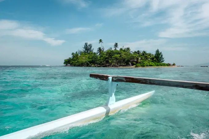 Pirogue on the way to paradise tropical atoll in Moorea Island lagoon. French Polynesia