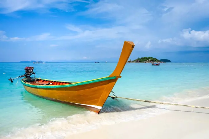 Traditional long tail boat on sunrise beach, Koh Lipe, Thailand