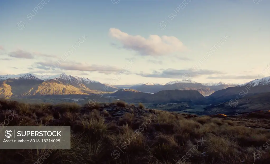 Snow capped Southern Alps in late afternoon light - New Zealand