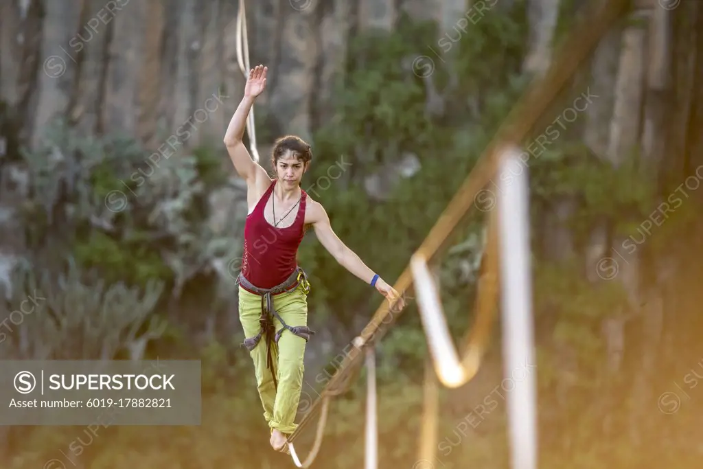 One girl balancing on a highline at "El Gato" canyon near huasca