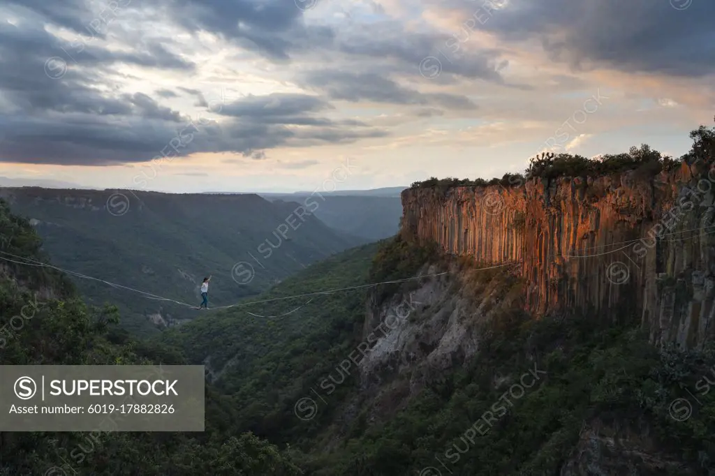 One person balancing on a highline at "El Gato" canyon in the area of Aguacatitla in Huasca de Ocampo, Hidalgo, Mexico.