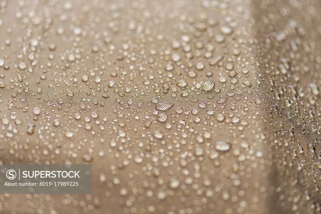 Drops of rain, water on a waterproof fabric close-up.