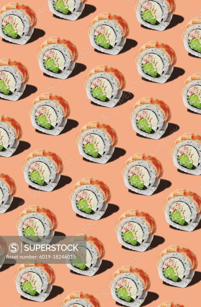 Pattern of rolls with prawn fillet on pinkish orange background